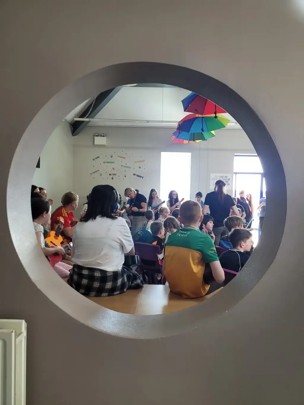 Group workshop seen through a window