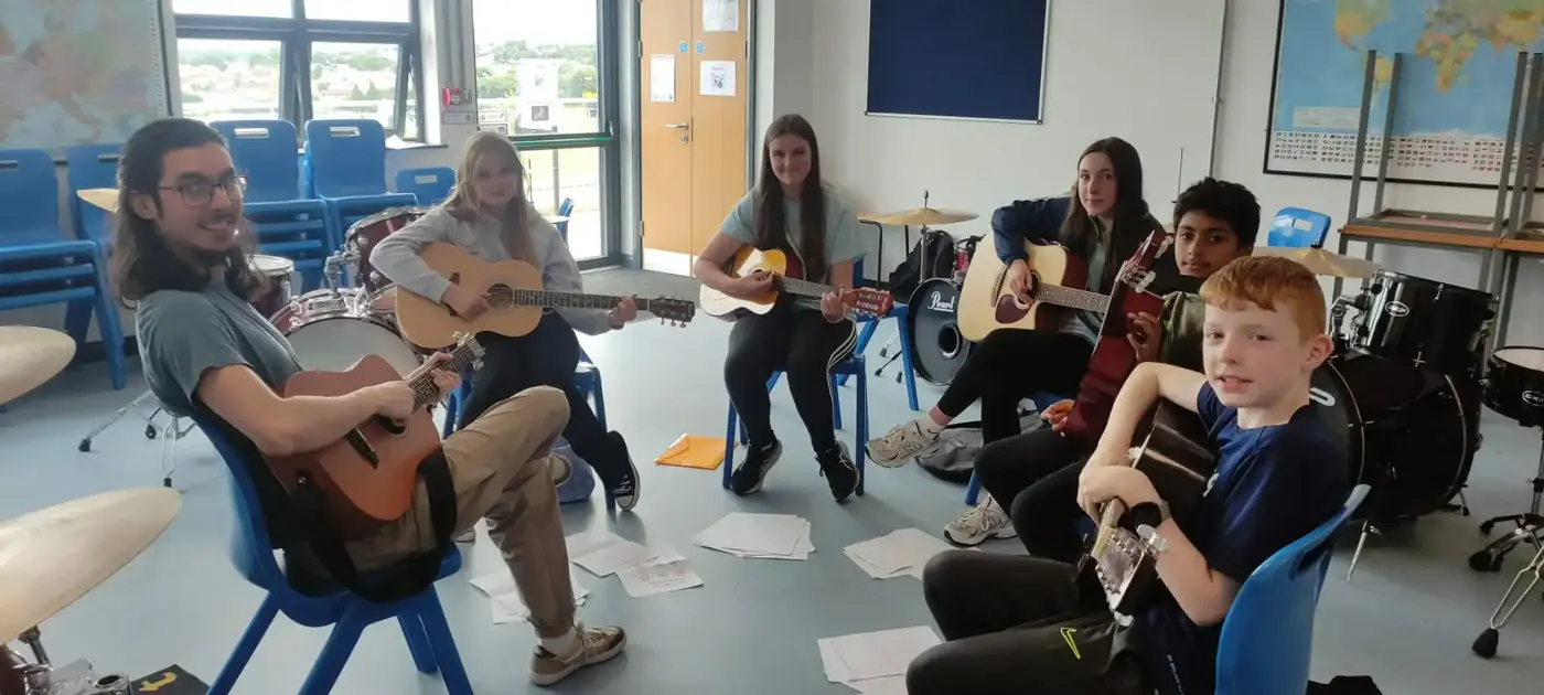 Guitar ensemble playing in a circle